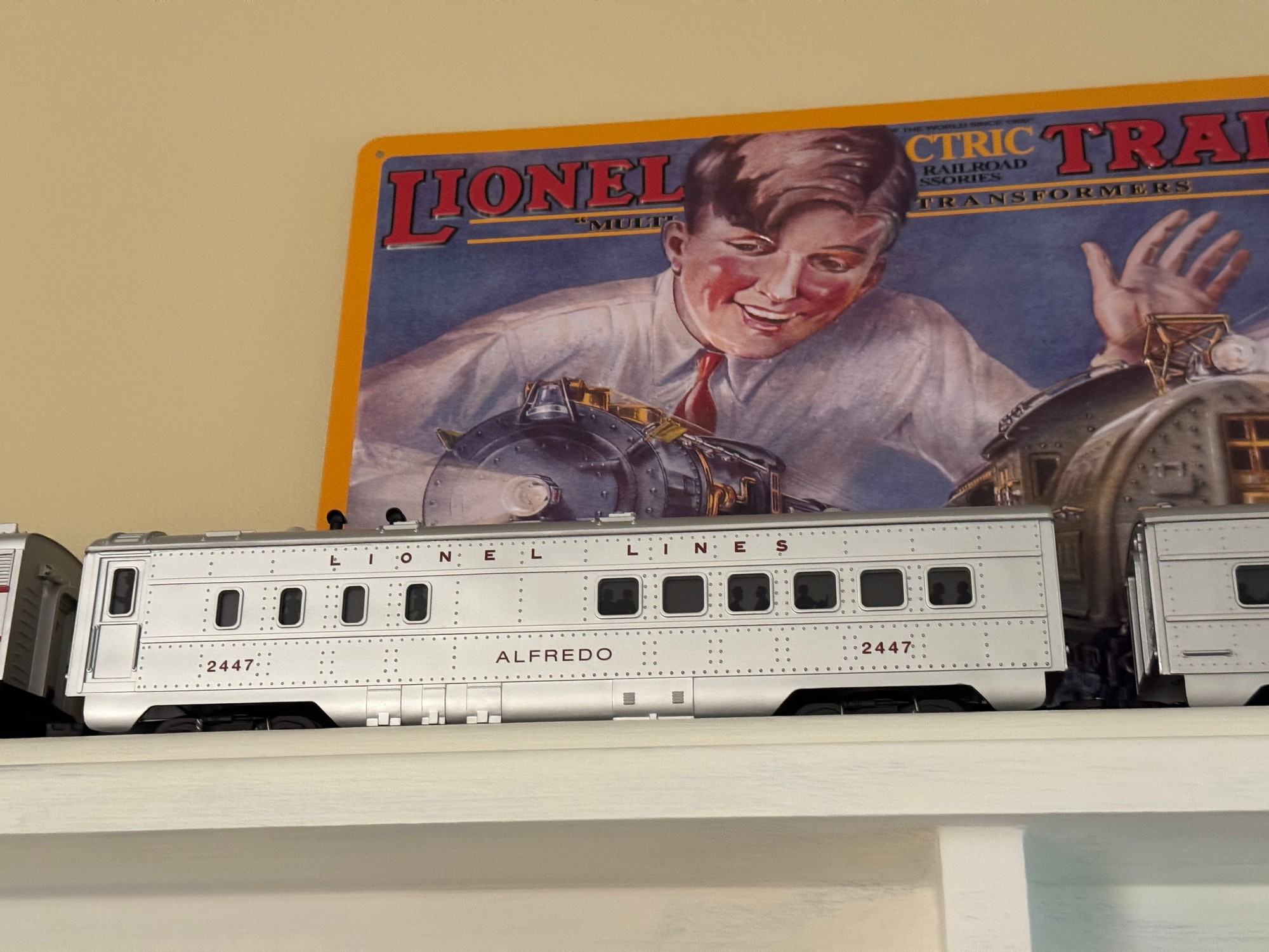 A model railway carriage and a vintage train illustration